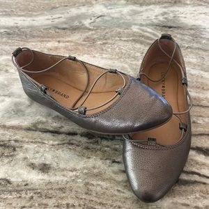 6.5 Lucky Brand Flats. Never worn. Pewter color
